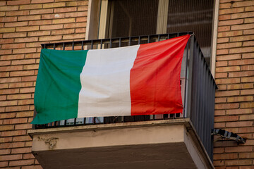 Italian flag hanging on a window