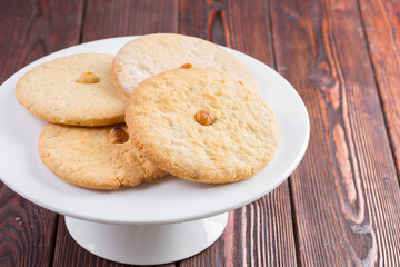 Oat cookies served on wooden table close up