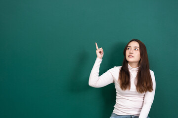 space women with point on green wall