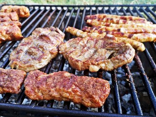 Meat, kebab and sausages on the barbecue.