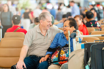 Fototapeta na wymiar Happy smiling Senior couple in airport.