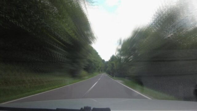 Speed Up Dashboard Dash Cam Point Of View POV Driving On Countryside Road, Slovenia. Hyper Lapse Hypersmooth Motion Effect. Amazing Landscape And Natural Valley And Forest Covering Hills. Forward Wide