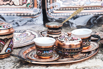 Traditional handmade souvenir from Bosnia and Herzegovina - turkish coffee pot with small copper cups