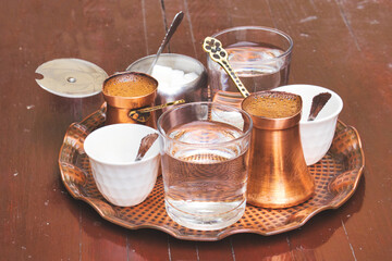 Delicious Bosnian coffee is served with rahat lokum dessert in the traditional turkish coffee pot