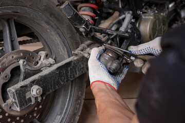 The process of replacing brake pads on a motorcycle.