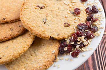 Oat cookies served on wooden table close up