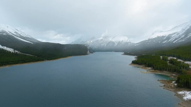 Drone shows an excellent view of Spray Lakes Reservoir near the mountains in Alberta, Canada 