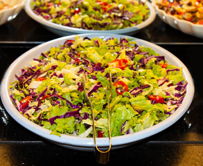 Catering food, salad in a white plate, buffet
