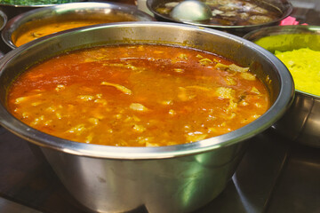 The chef in the kitchen of the restaurant cooking traditional Bosnian dishes including delicious bey's soup (begova corba)