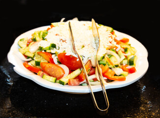 Catering food, salad in a white plate, buffet