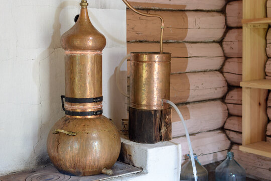Moonshine still with tube for pure product.