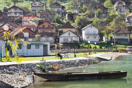 An elder woman retired on pension on the coast of the beautiful Drina river in Zvornik, Bosnia and Herzegovina