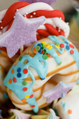 
Large donut in blue-blue glaze with multi-colored sprinkles