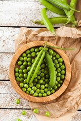Fresh green peas in bowl  on table close up