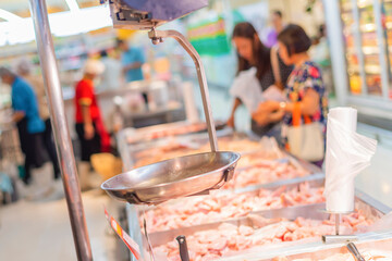 Electronic scale. weighing meat in supermarket.