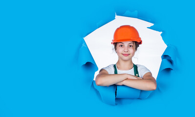 baby building. cute kid putting on construction helmet. childhood happiness concept. Little girl engineer. Visiting Construction Site. childhood and education concept. copy space