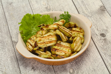 Grilled eggplant slices served basil