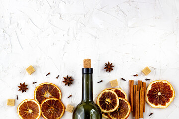 Bottle of wine and spice on white background. Ingredients for a mulled wine.