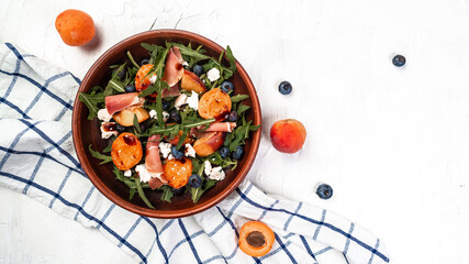 Vibrant grilled peach salad with blueberries and creamy goat cheese, Healthy vegan salad, place for...