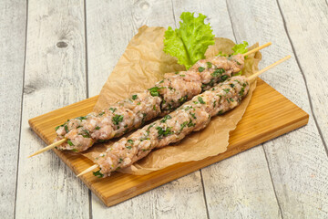 Raw minced pork skewer kebab for grill