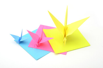 Origami folding crane birds on white