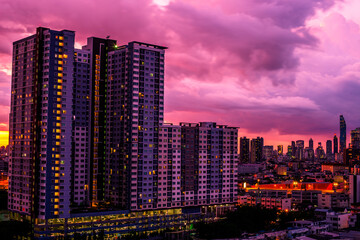 Fototapeta na wymiar panoramic high-angle evening background of the city view,with natural beauty and blurred sunsets in the evening and the wind blowing all the time,showing the distribution of city center accommodation