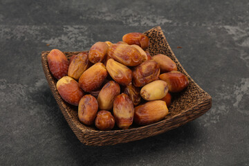 Sweet tasty dry dates in the basket