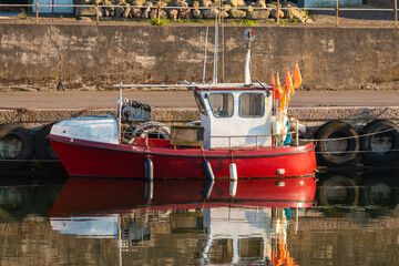 Fototapeta na wymiar Small fishing boat docked in Bornholm Ronne port.