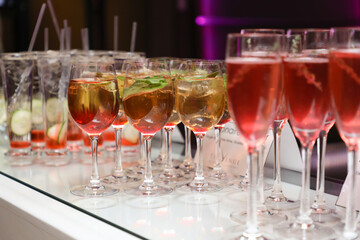 Red cocktail welcome drink on a bar.