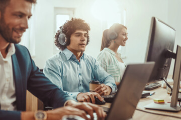 Obraz premium Three Business People In The Office