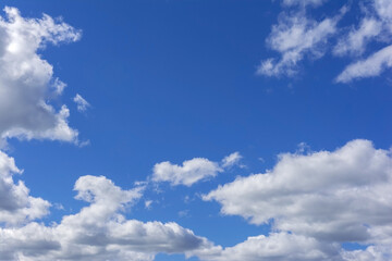 white fluffy clouds in a clear blue sky