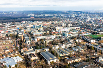 Fototapeta na wymiar Lviv, Ukraine Ukrainian city of Lvov above high angle bird's eye view from airplane window on cloudy winter day with residential apartment buildings
