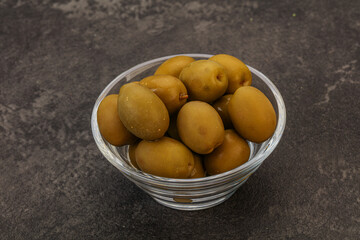 Green pickled olives in the bowl