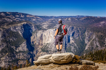 Backpacking in the Yosemite National Park, man enjoying the view