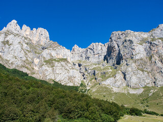 limestone mountains over blue sky in Picos de Europa, Fuente De
