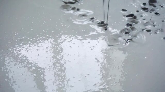 filling the surface with a special liquid for leveling the floor.