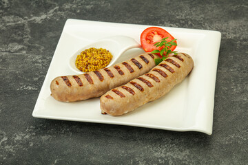 Grilled natural pork sausages with sauce