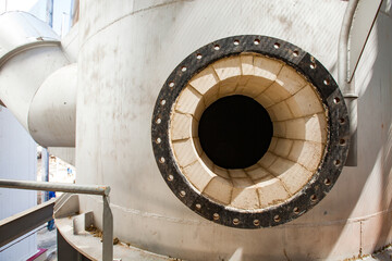 Sulphuric acid plant. Ceramics fire clay bricks of sulphur-burning furnace. Maintenance manhole