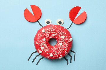 Crab made of donut on blue background