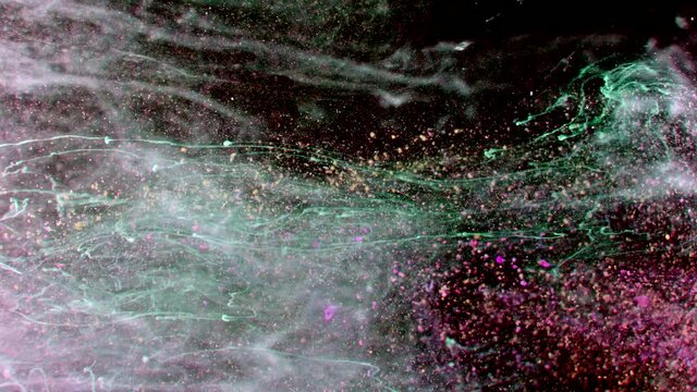 Abstract particles in multicolor liquid flow and float motion on black