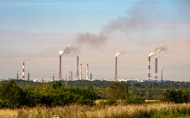 Fototapeta na wymiar The plant damaging the environment by emissions of toxic gases into the atmosphere.