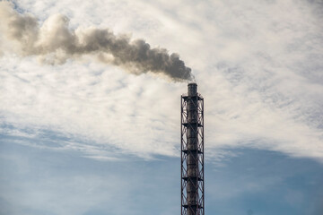 Fuming chimneys of an industrial plant. Greenhouse effect of ecology.