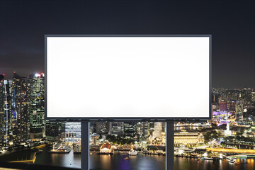 Blank white road billboard with Singapore cityscape background at night time. Street advertising poster, mock up, 3D rendering. Front view. The concept of marketing communication to sell idea.