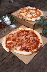 Homemade Pizza. pizza on the box with cheese. of Wooden table Top view flat lay with copy space