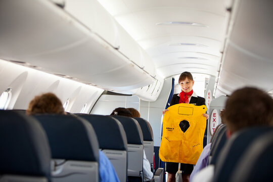 Airplane: Stewardess Hold Floatation Vest