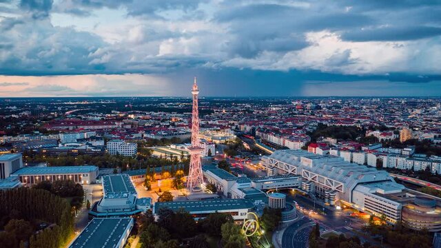 Day to Night Aerial View Hyper Lapse of Berlin cityscape with radio tower, Berlin, Germany