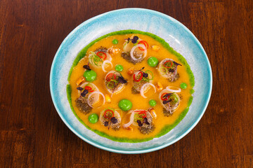 Scallops with sauce and chili