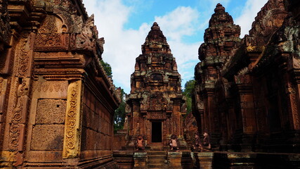 Naklejka premium Cambodia Siem Reap－July 27, 2016: Ancient architecture and natural scenery in Angkor Wat Cambodia. Photo taken in outside area. (Lady temple, Water fall (Phnom Kulen), Beng Mealea temple and Tonle Sa