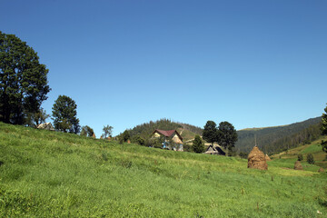 a haystack in the middle of a mountain landscape