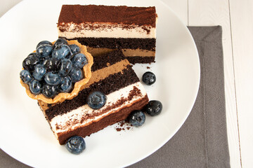 cheesecake with berries on the white plate